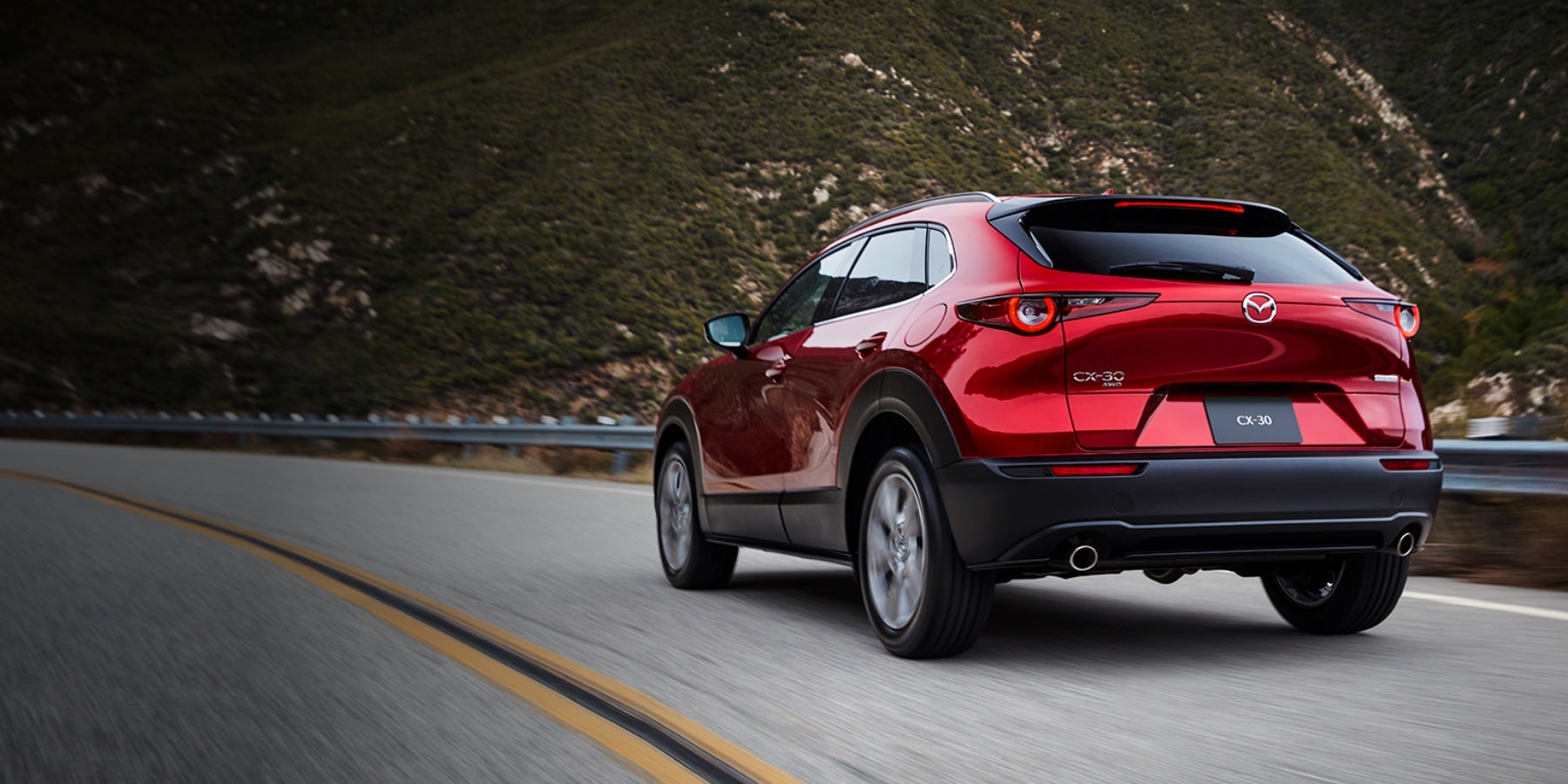Red 2020 Mazda CX-30 Driving on the road | Seacoast Mazda in Portsmouth, NH