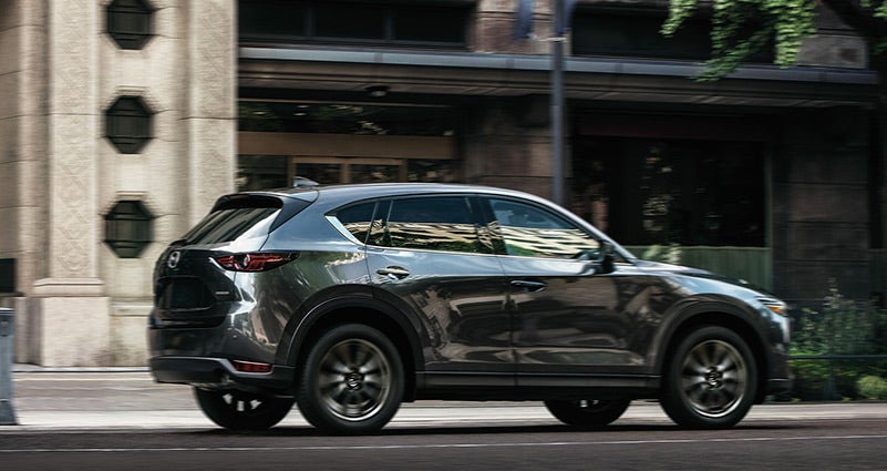 Grey 2020 Mazda CX-5 Driving on the road | Seacoast Mazda in Portsmouth, NH