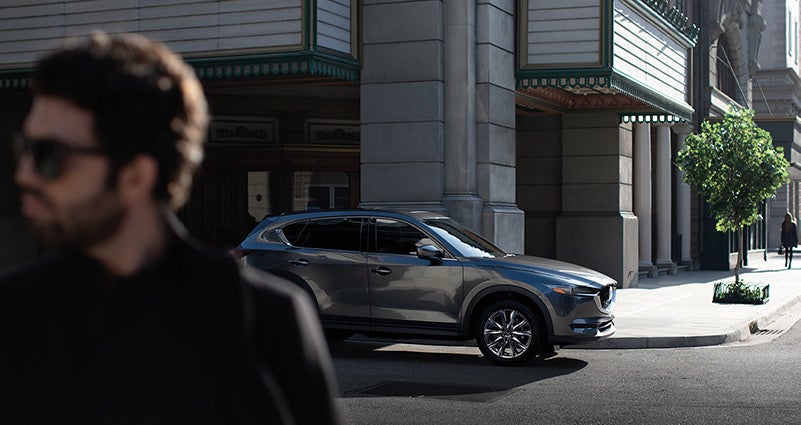 Grey 2020 Mazda CX-5 parked on the street | Seacoast Mazda in Portsmouth, NH