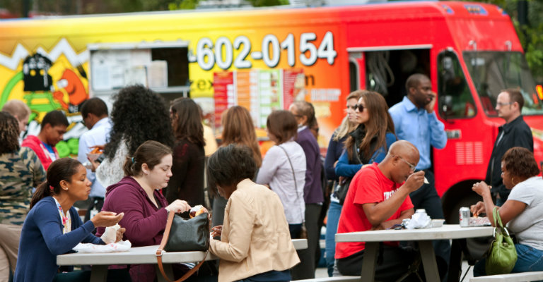 people eating at food truck