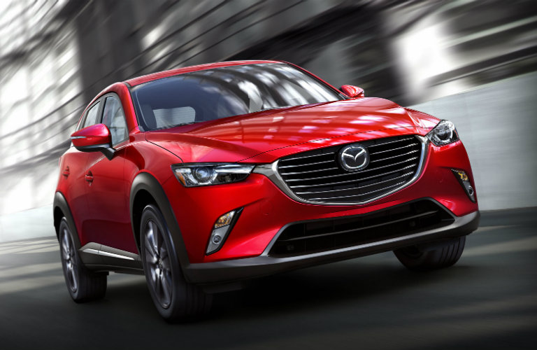 2018 Mazda CX-3 driving down road.