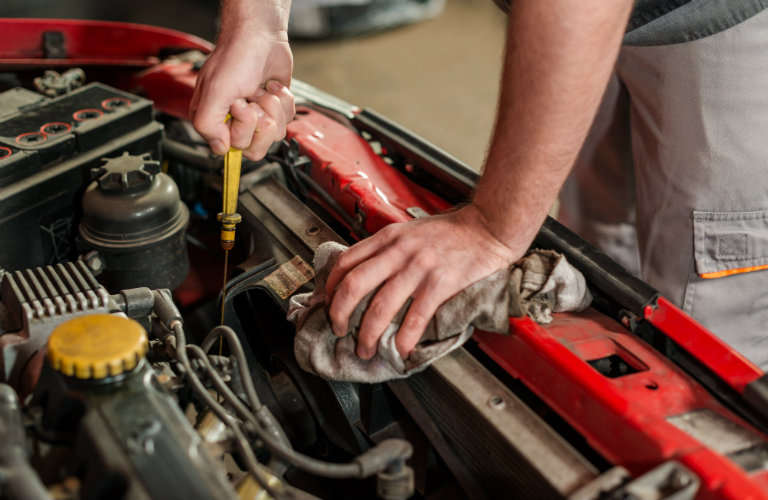 Man performing a Mazda3 oil change