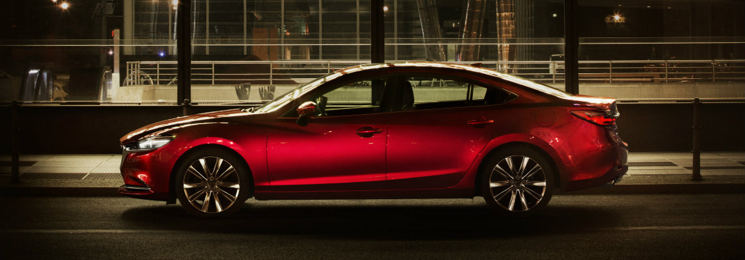 Red-2018-Mazda6-parked-in-front-of-building-with-big-windows