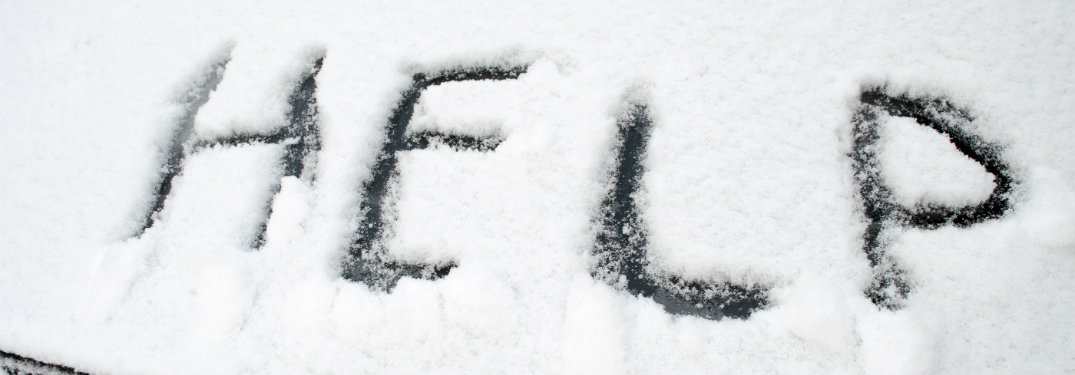 Help-written-in-snow-on-windshield
