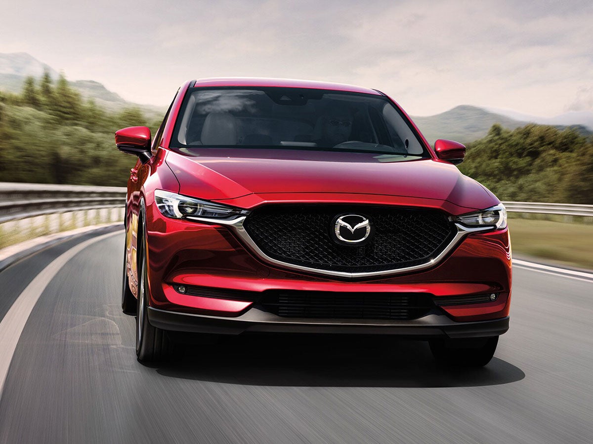 Person driving a Mazda CX-5 after getting a Mazda 30,000 mile service