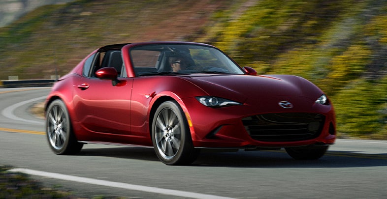 A Mazda MX-5 Miata RF driving a mountain road