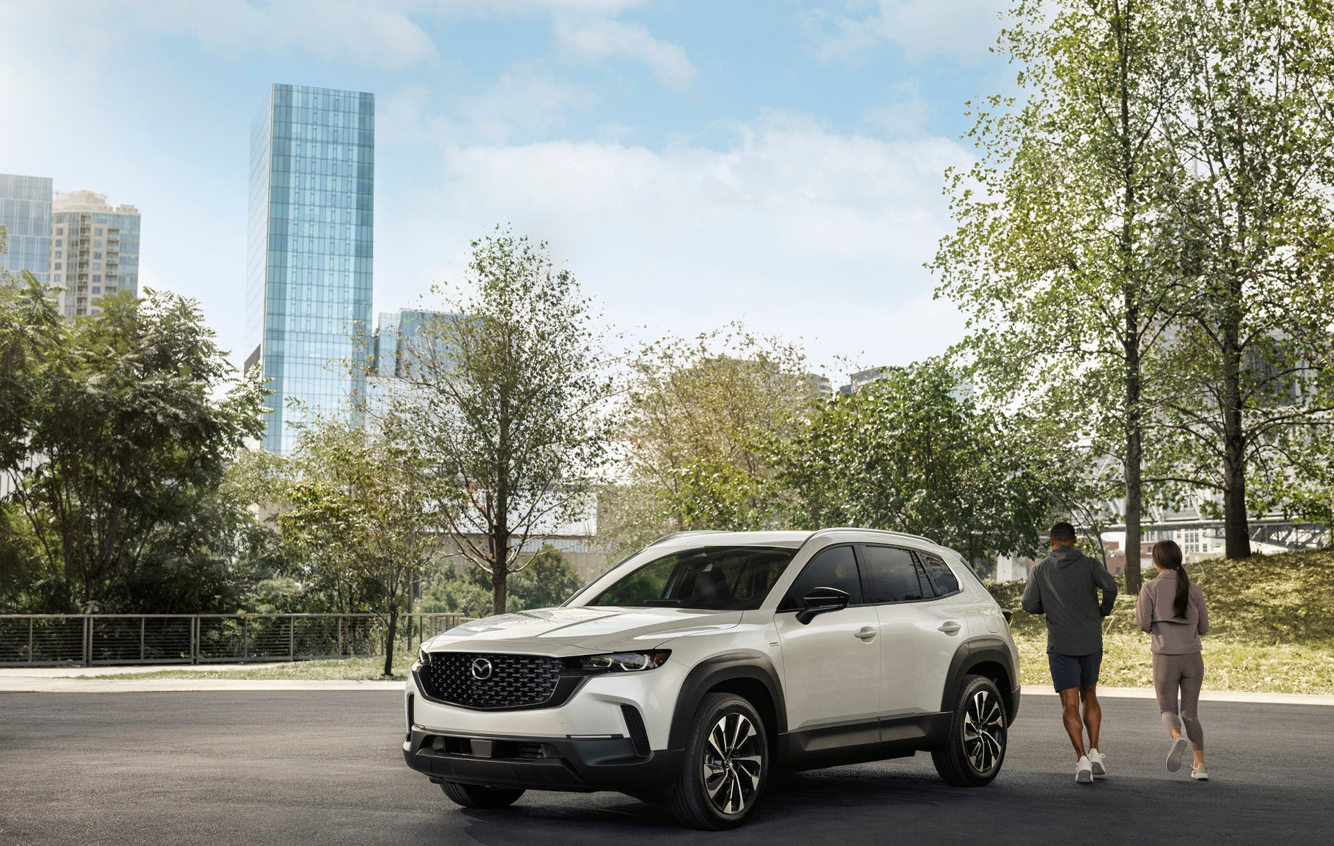 A couple near their 2025 Mazda CX-50