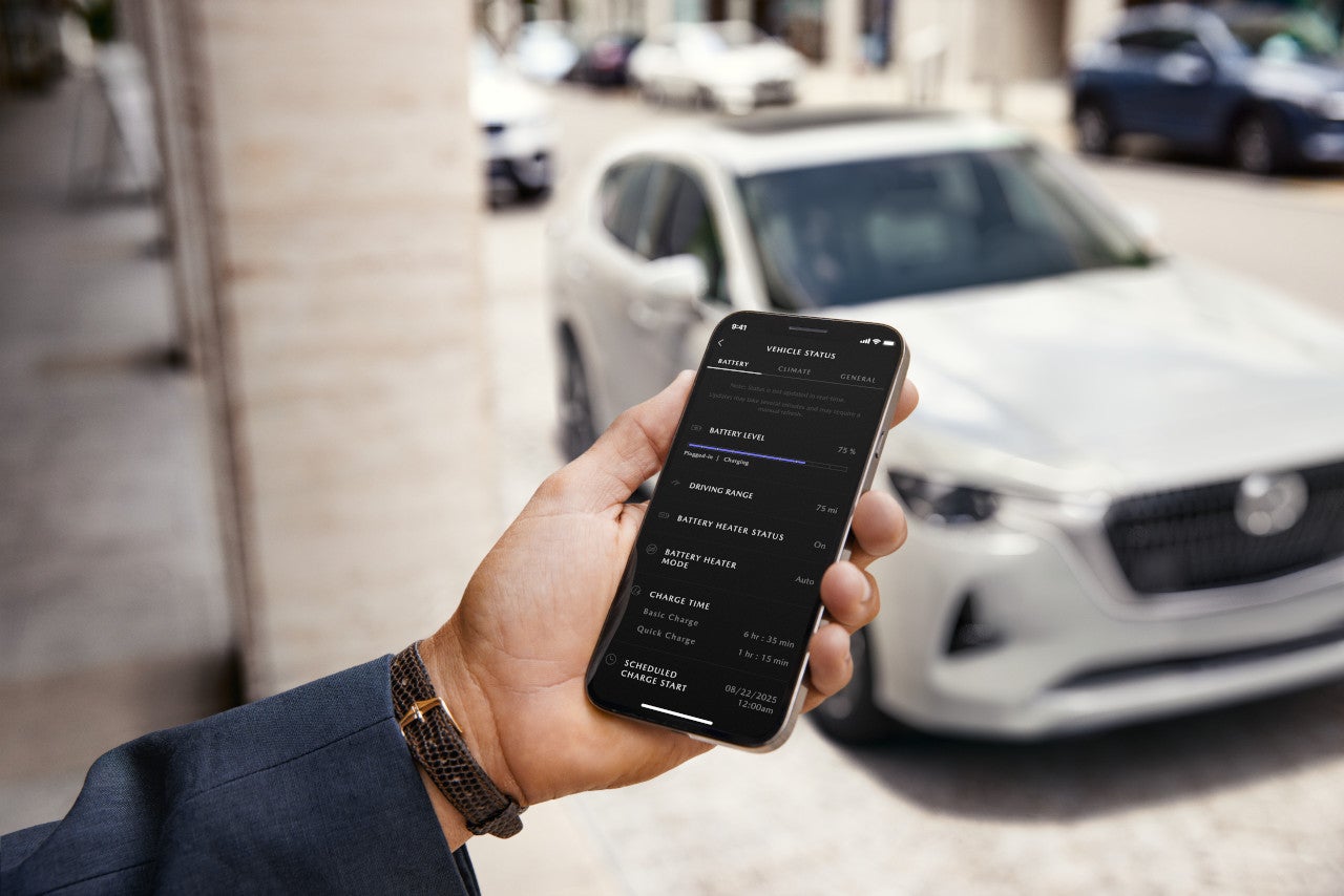 A 2025 Mazda CX-90 owner using the MyMazda app on their mobile device