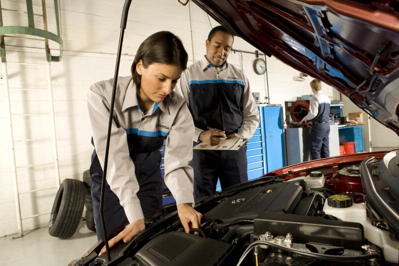 Mazda technician checking for causes of water pump failure